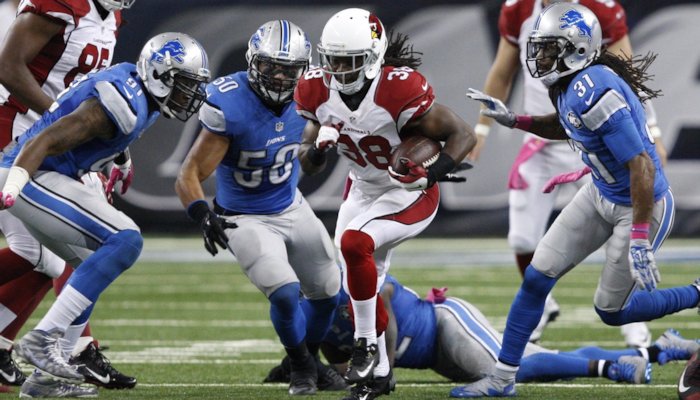 Andre Ellington (38) carries the ball to score a touchdown during the fourth quarter against the Detroit Lions at Ford Field. <span style=